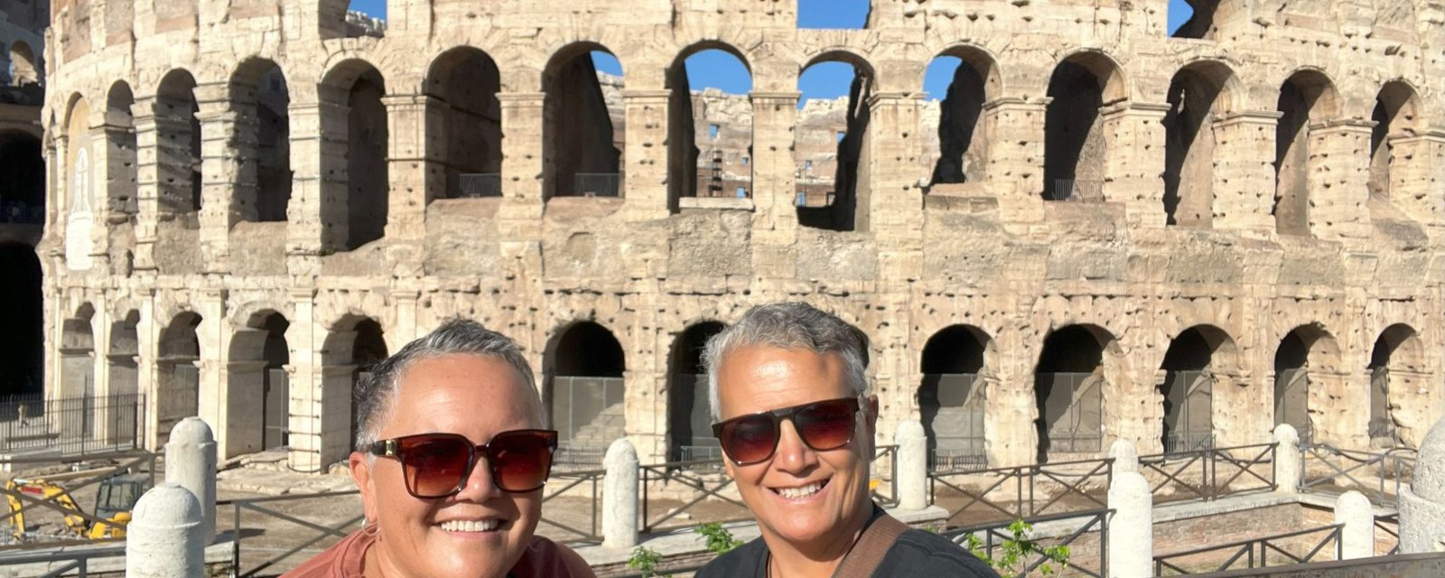 Tania and Toni standing outside of the Colosseum in Rome